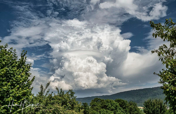 Cumulus Cloud Towering Above the Jura Mountains